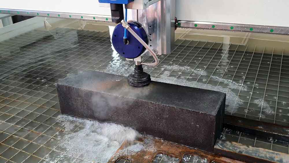 Abrasive water jet cutting concrete block Abrasive water jet cutting concrete block